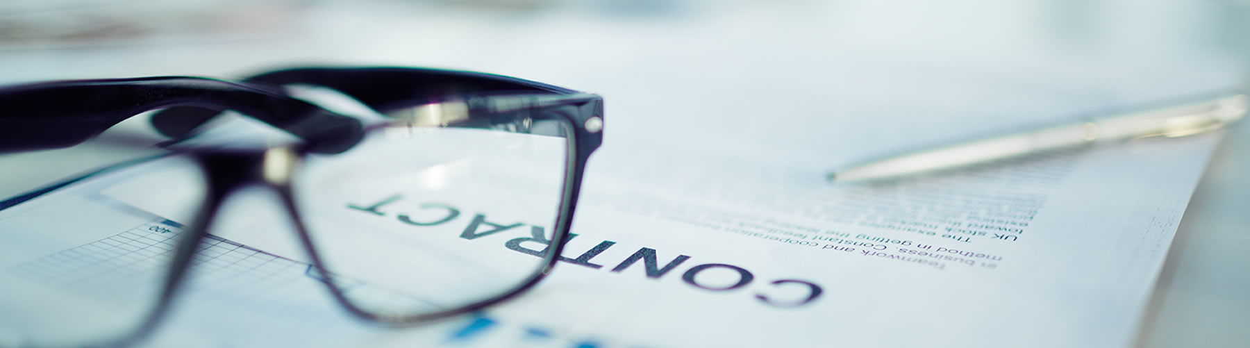 business documents with glasses on the table