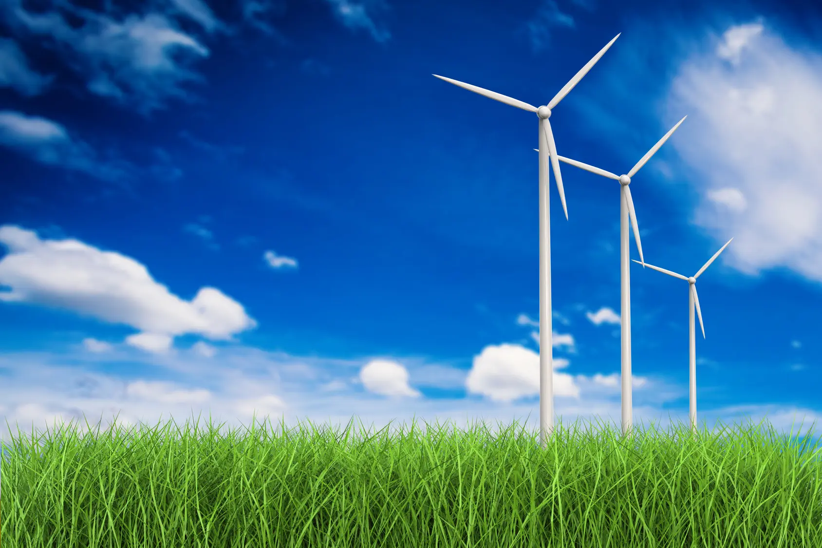 Fotolia_113160538_wind turbines in grass field_M