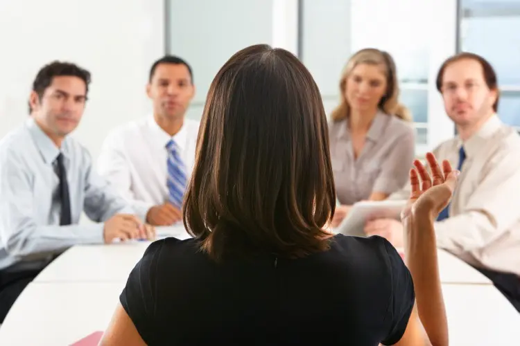 Fotolia_52598491_Woman-speaking-in-meeting_M-e1456946752258