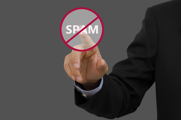 businessman pointing at an anti spam sign