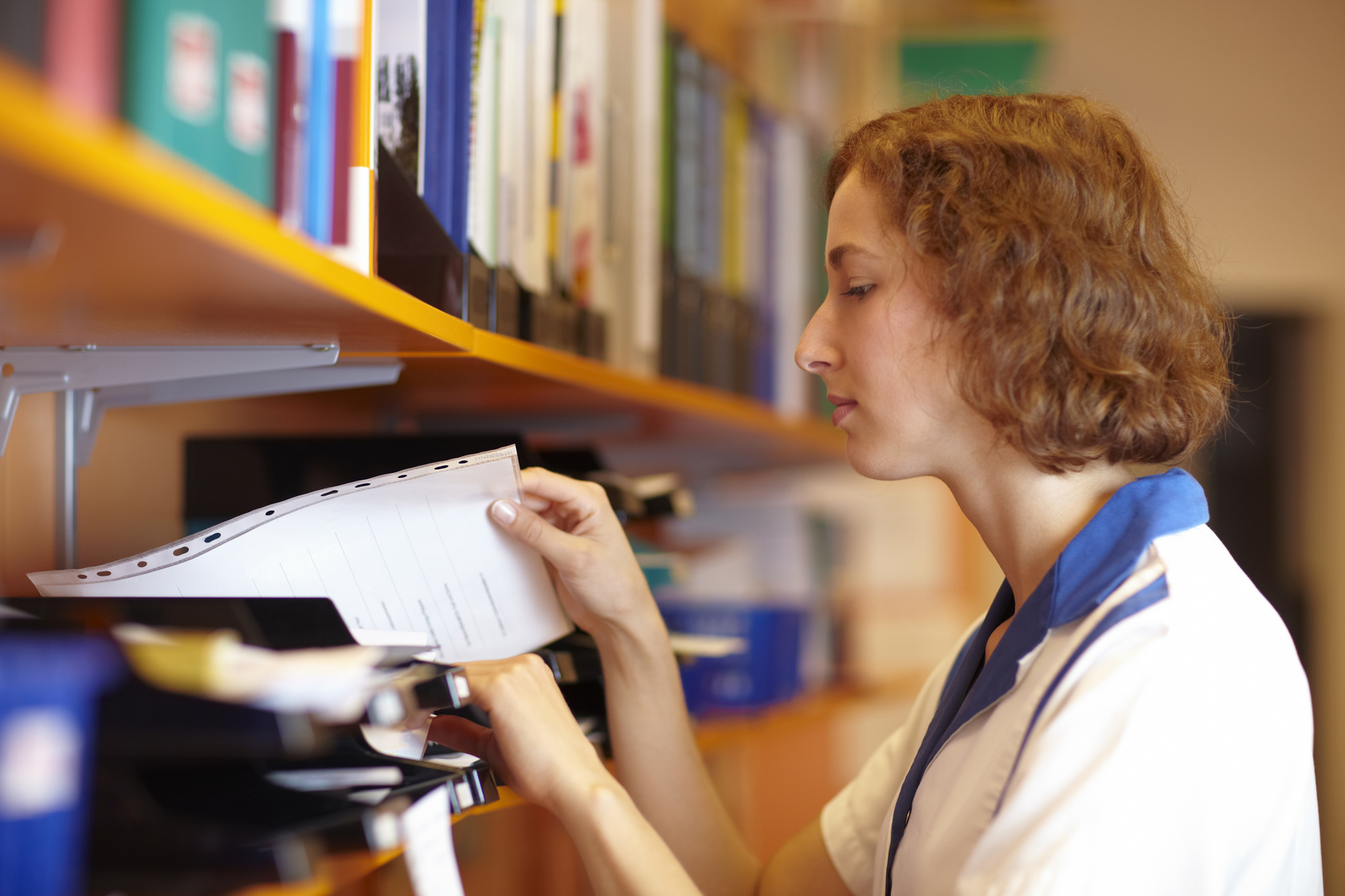 Woman looking at files