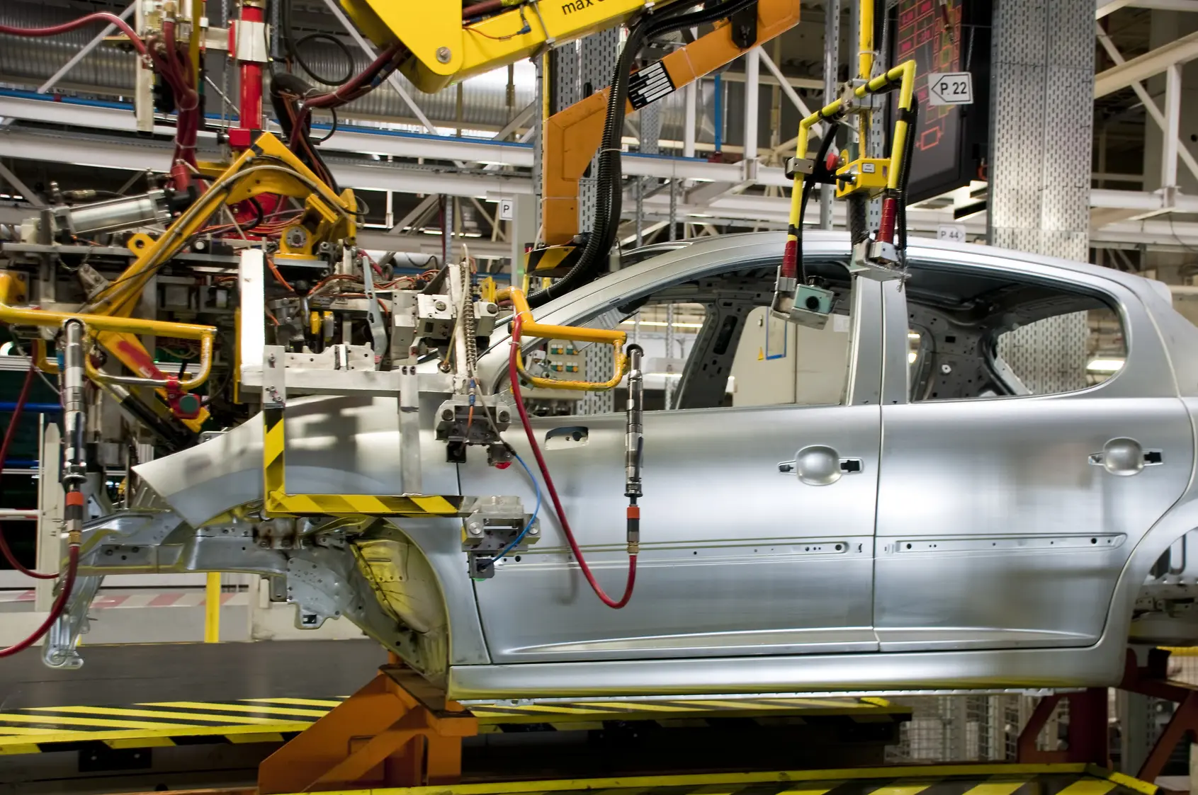 Automobile hanging in manufacturing plant