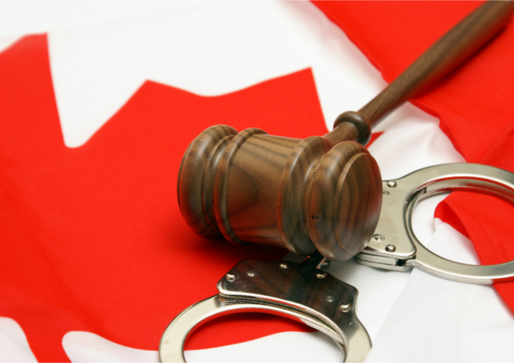 gavel with Canadian flag and handcuffs