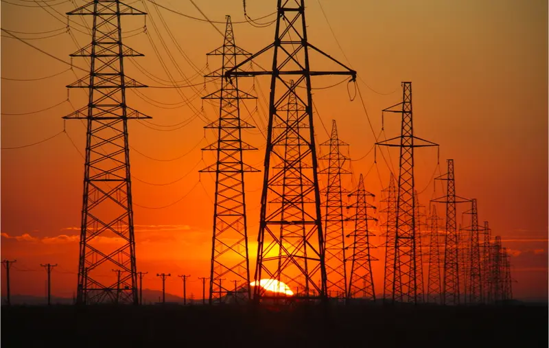 Transmission lines at sunset