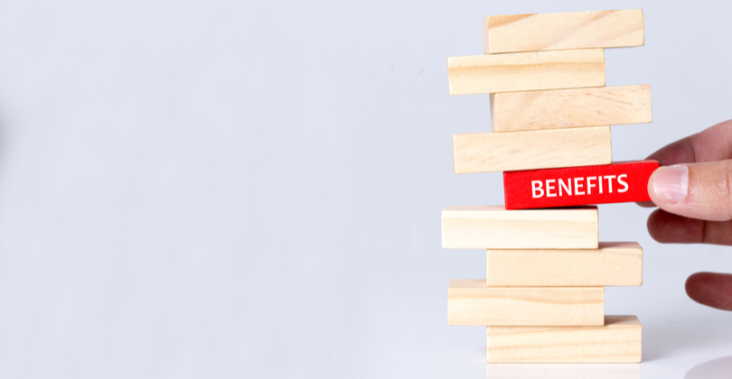 a stack of blocks with a hand pulling a block that says benefits