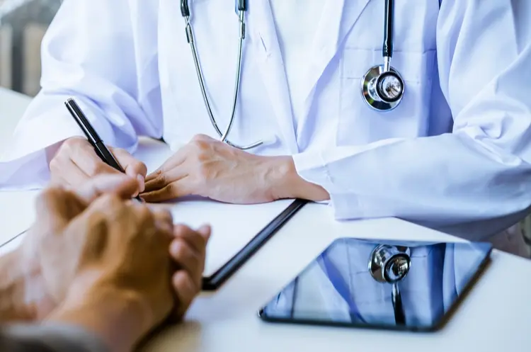 shutterstock_602298146_doctor with patient_web