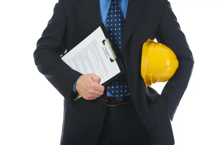 shutterstock_70128745business worker with hardhat_web