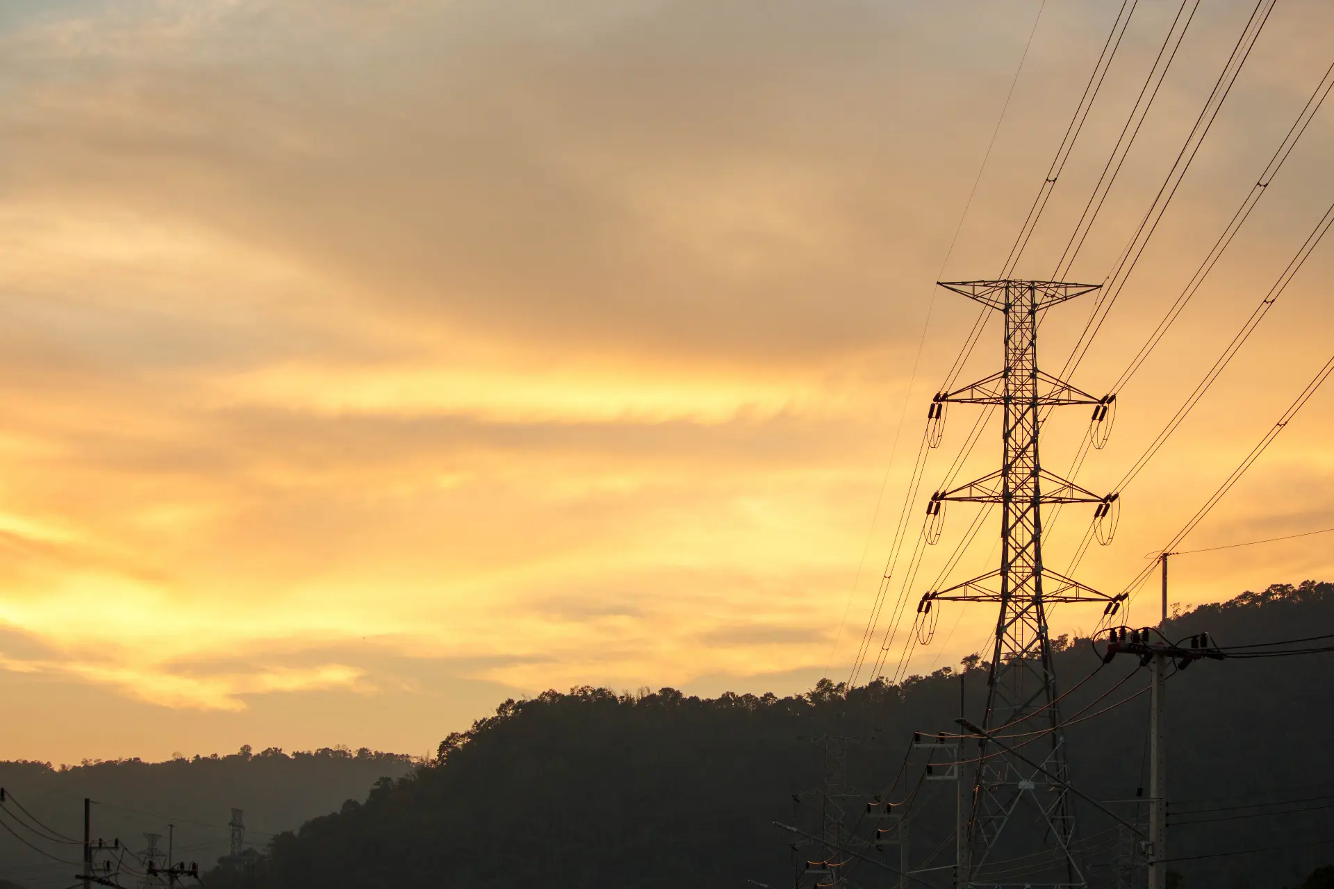 shutterstock_transmission lines yellow sunset 775770205