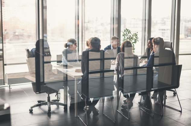 Group of lawyers discussing corporate transactions