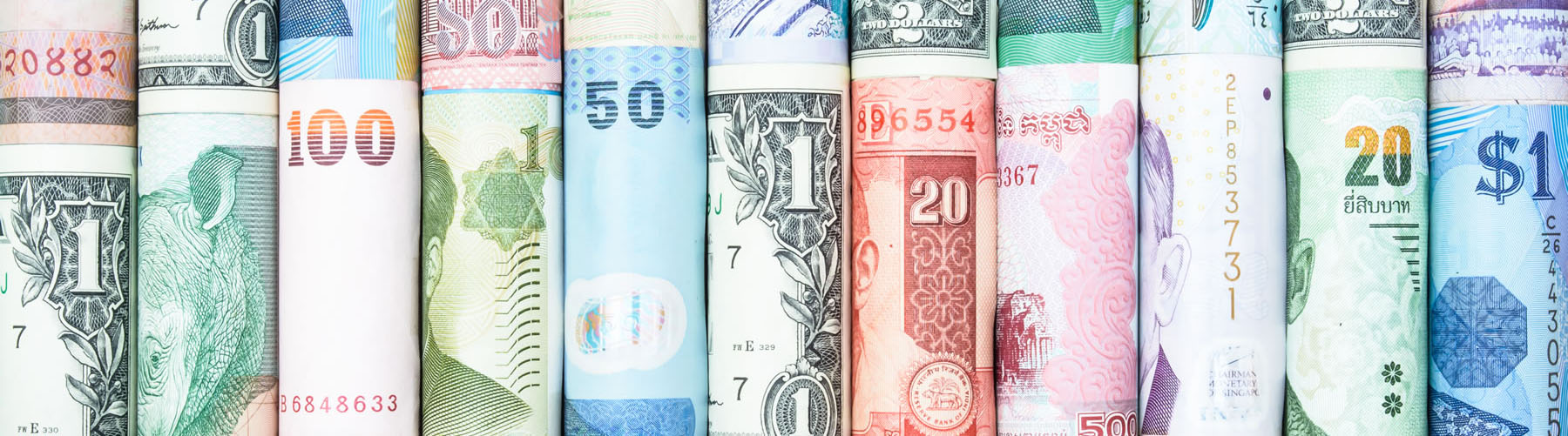 A backgrounds with colorful of many roll currency from many country